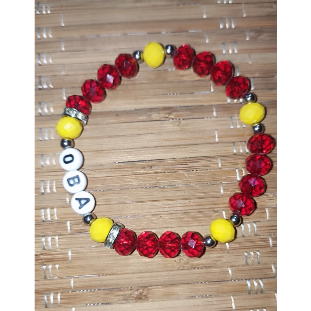 Pulseira de Proteção Artesanal de Obá com Cristais Vermelhos e Amarelos Pulseira de Proteção Artesanal de Obá com Cristais Vermelhos e Amarelos