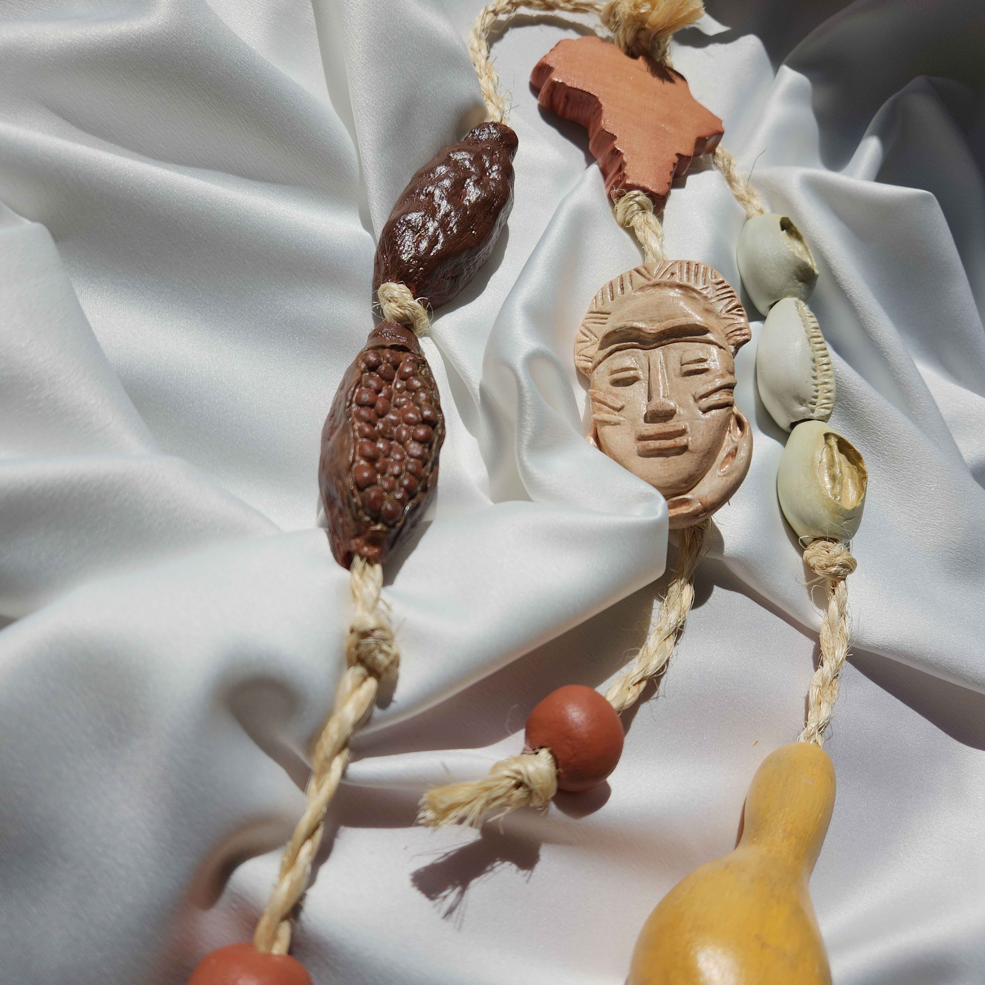 Penduricalho Ancestral Afro | Búzios, Pimenta-da-Costa e Cabaça Penduricalho Ancestral Afro | Búzios, Pimenta-da-Costa e Cabaça
