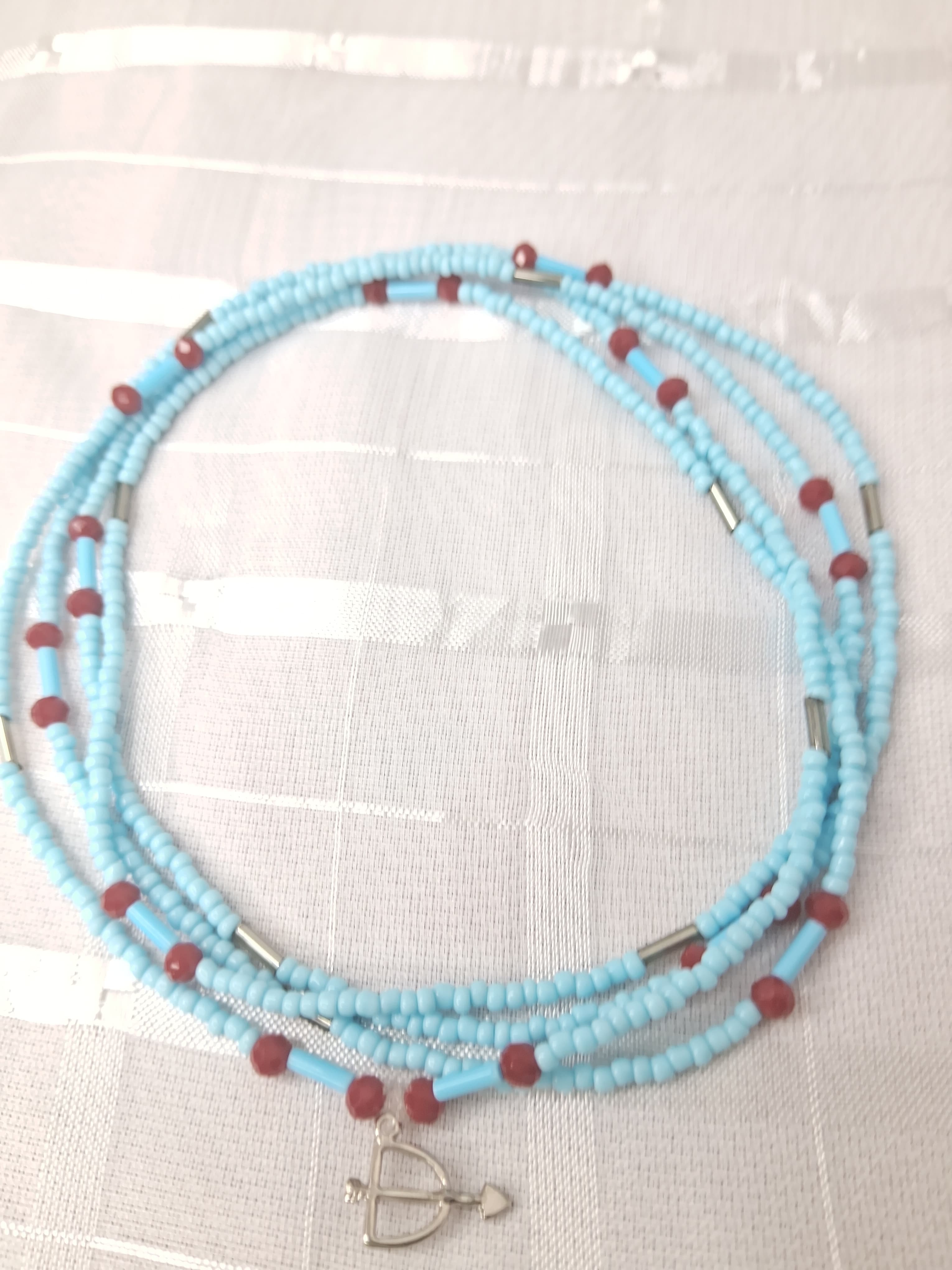 Fio de Oxossi com Vermelho Fio de Oxossi com Vermelho