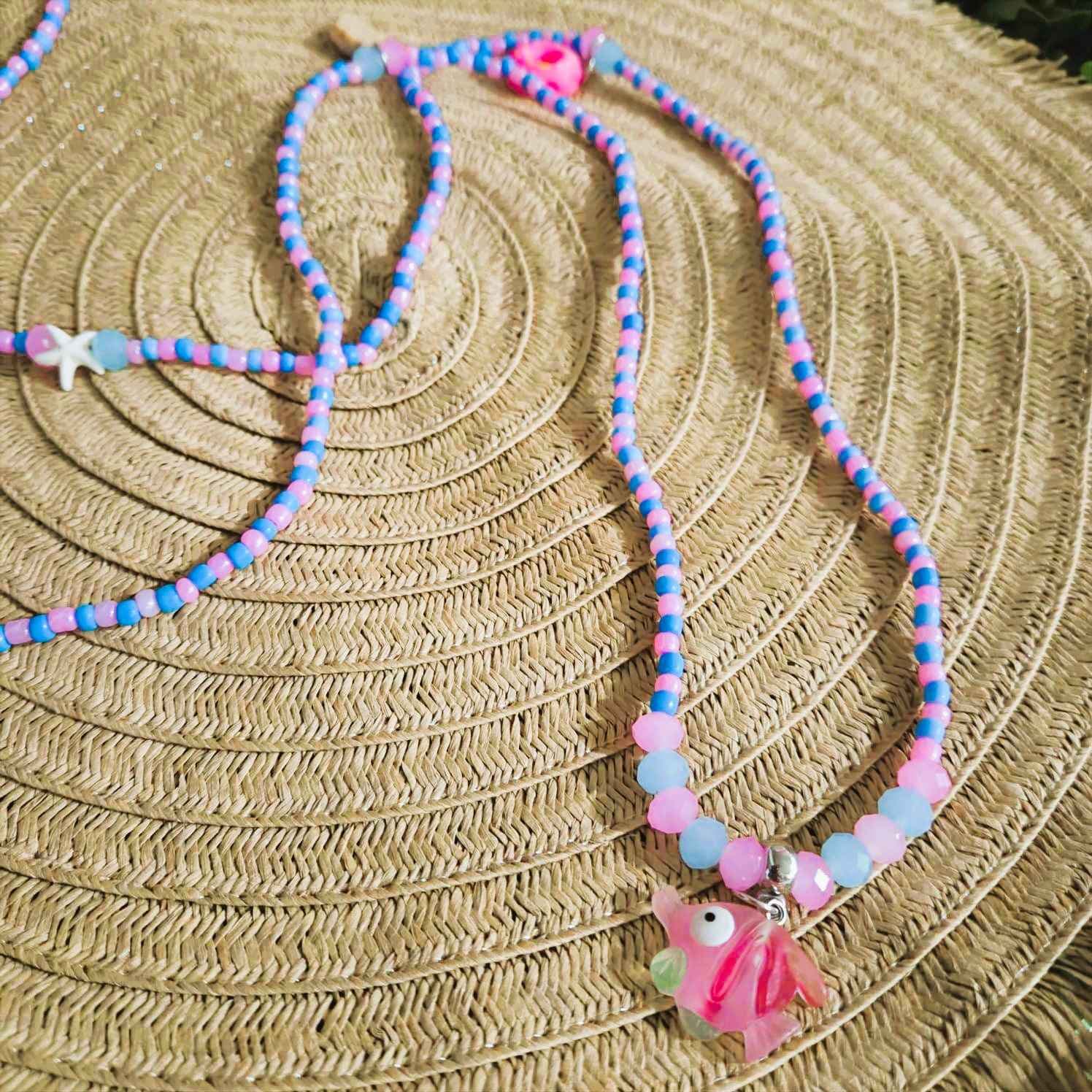 Guia de Erê Azul e Rosa Cristal 8mm | Fio de Conta 65cm com Pingentes Guia de Erê Azul e Rosa Cristal 8mm | Fio de Conta 65cm com Pingentes